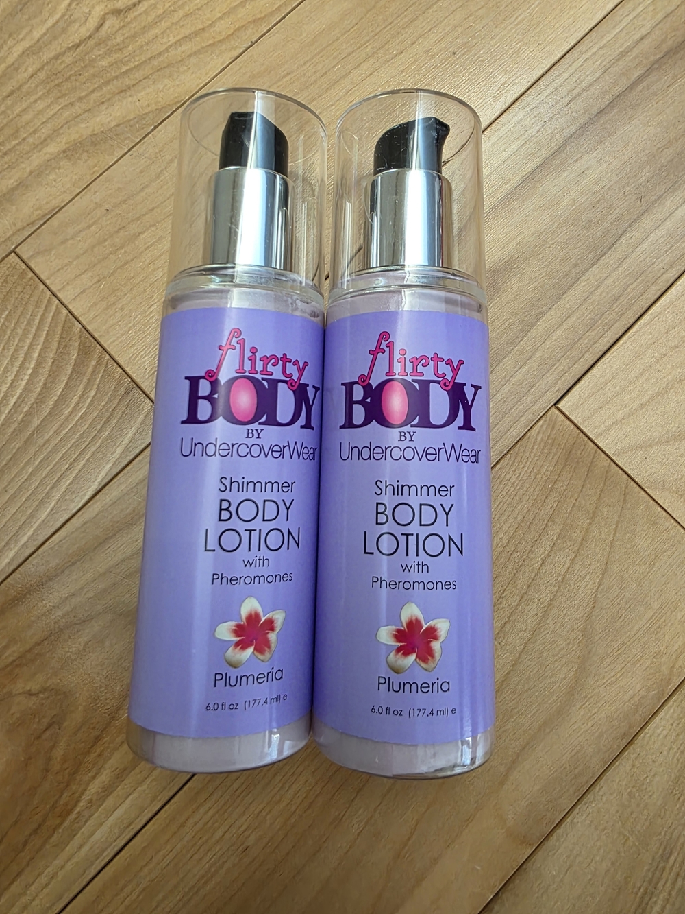 Flirty Body by undercoverwear shimmer body lotion with pheromones plumeria *New*